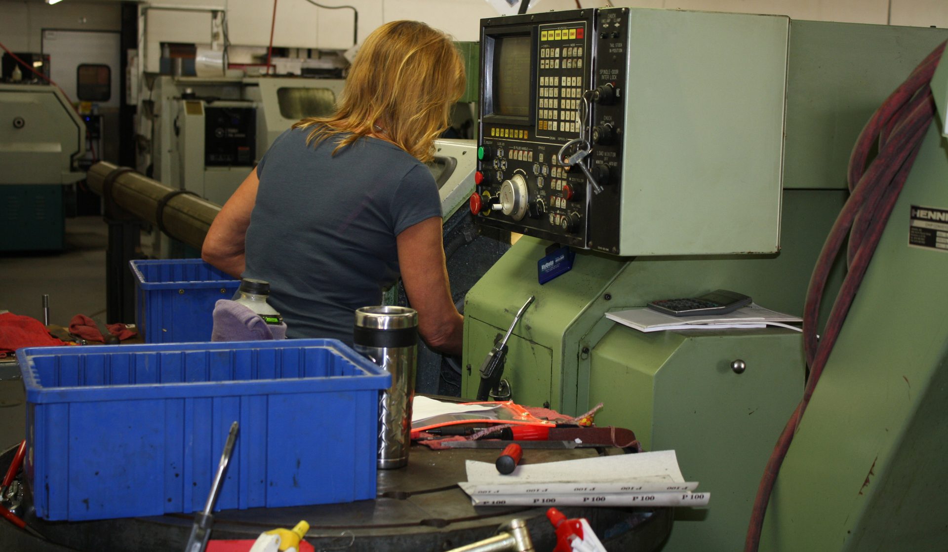 Damark machinist operating a CNC lathe in the Lomira, WI machine shop