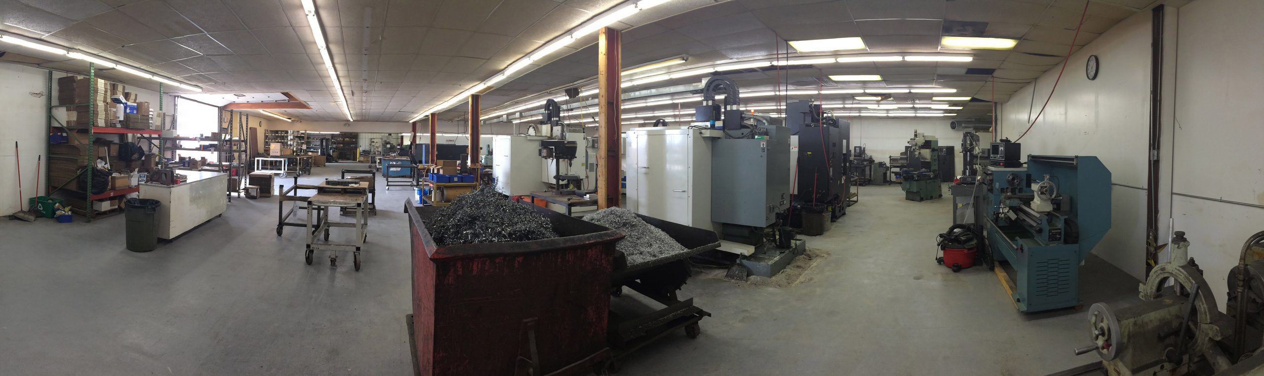 Wide view of the Damark Manufacturing machine shop floor in Lomira, WI, with CNC machining centers and lathes